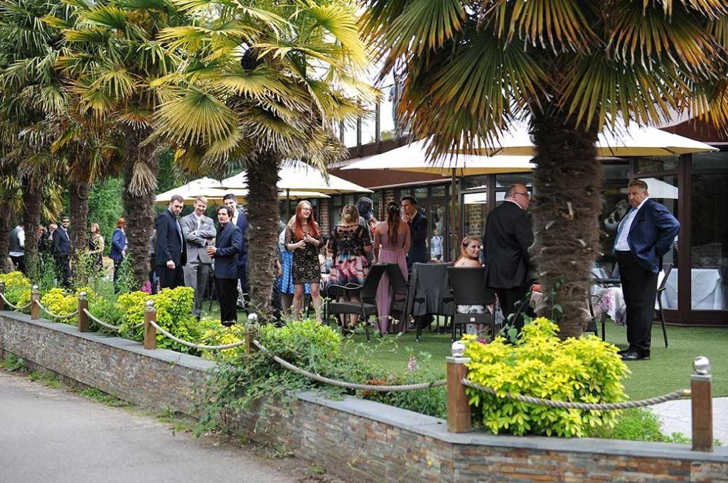 Frensham-ponds-hotel-wedding-guests-on-lawn.jpg